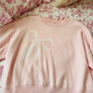 Pink Sweater with White Bow Design